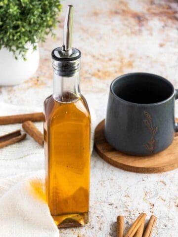 Tall bottle of syrup.