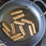 sausages in a fry pan.