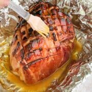 cooked ham with brown sugar ham glaze on top.