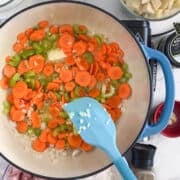 onions, garlic, celery being cooked in a pot.
