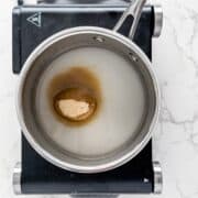 brown sugar, sugar and water in a pot.