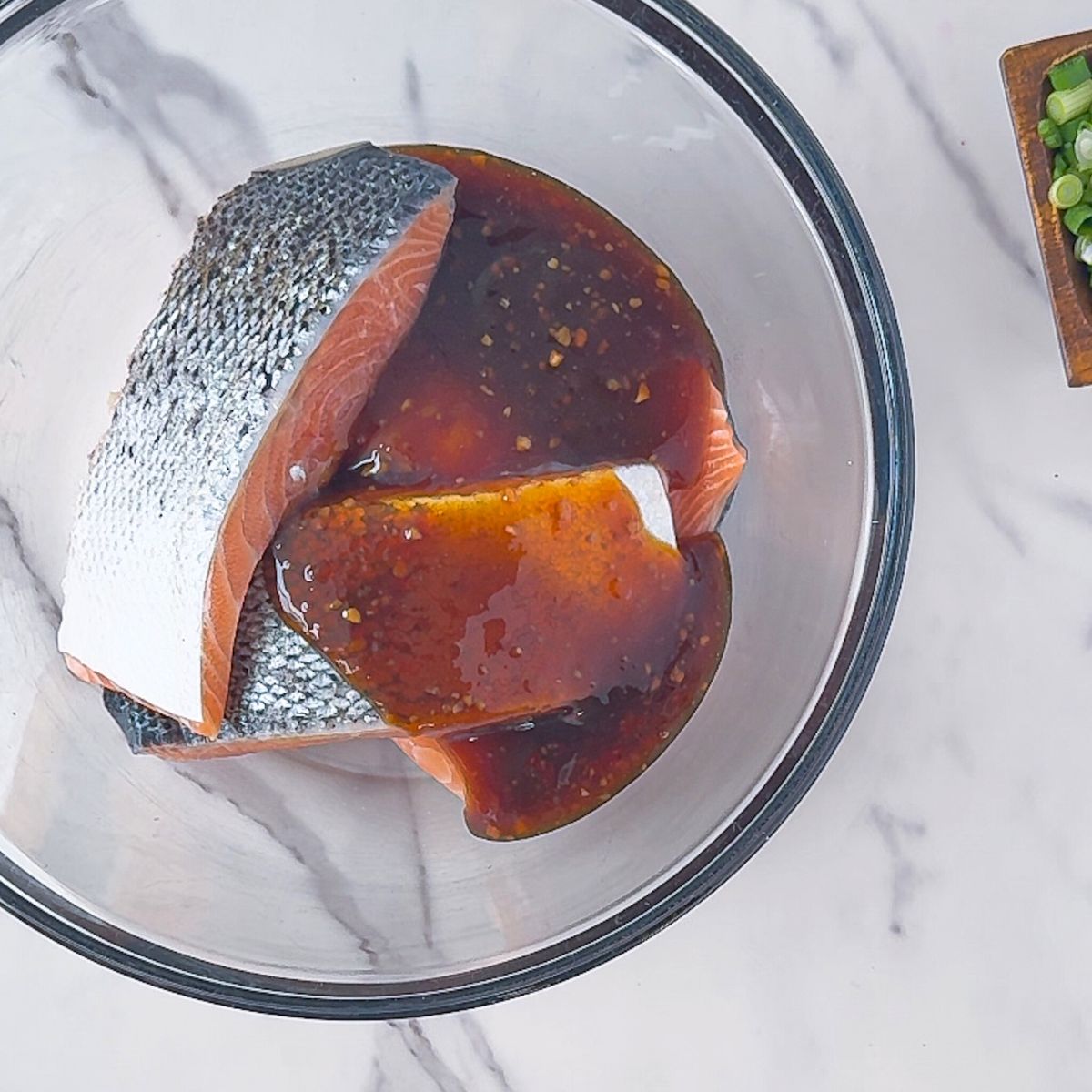 Marinating the salmon in the teriyaki sauce.