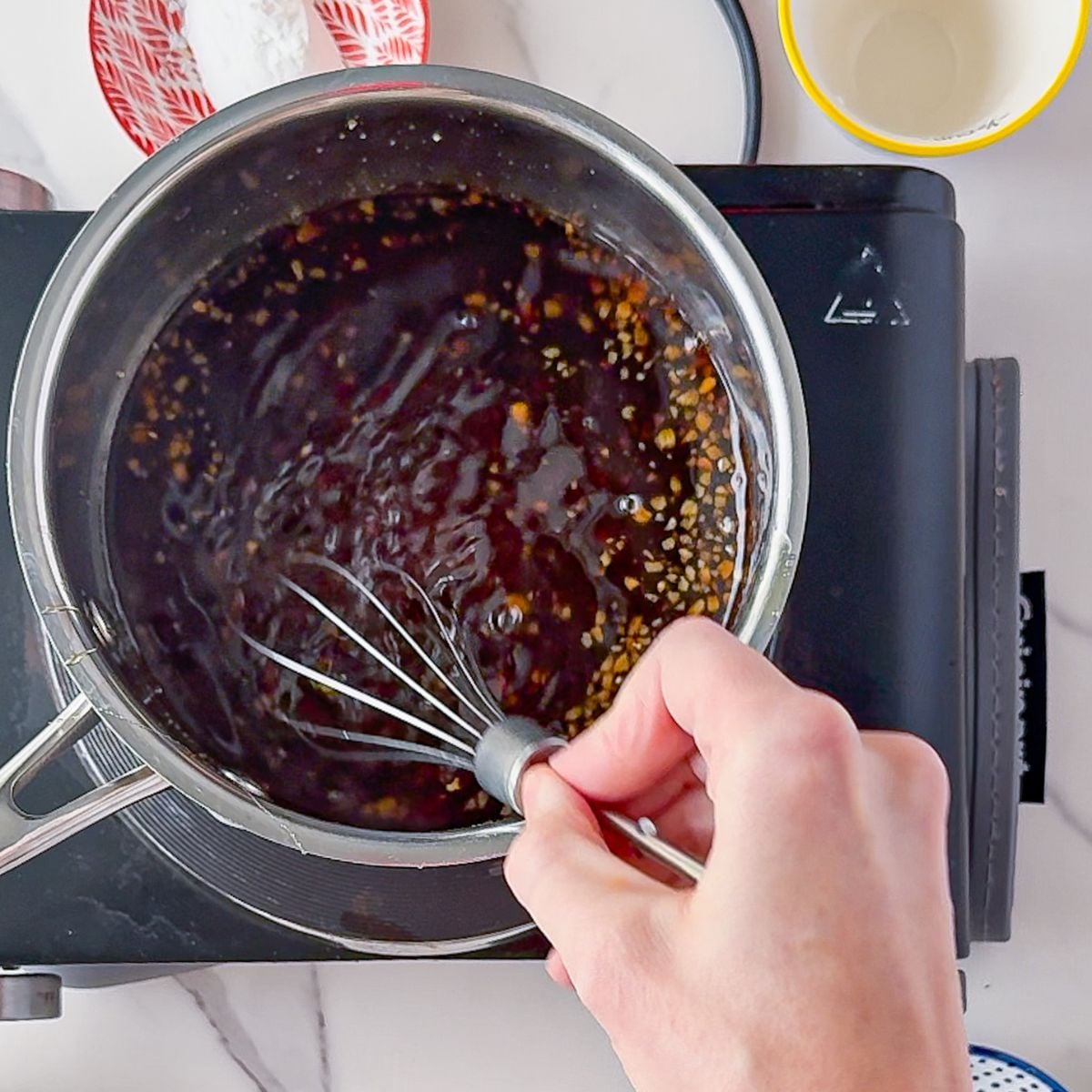Stirring the ingredients for teriyaki sauce.