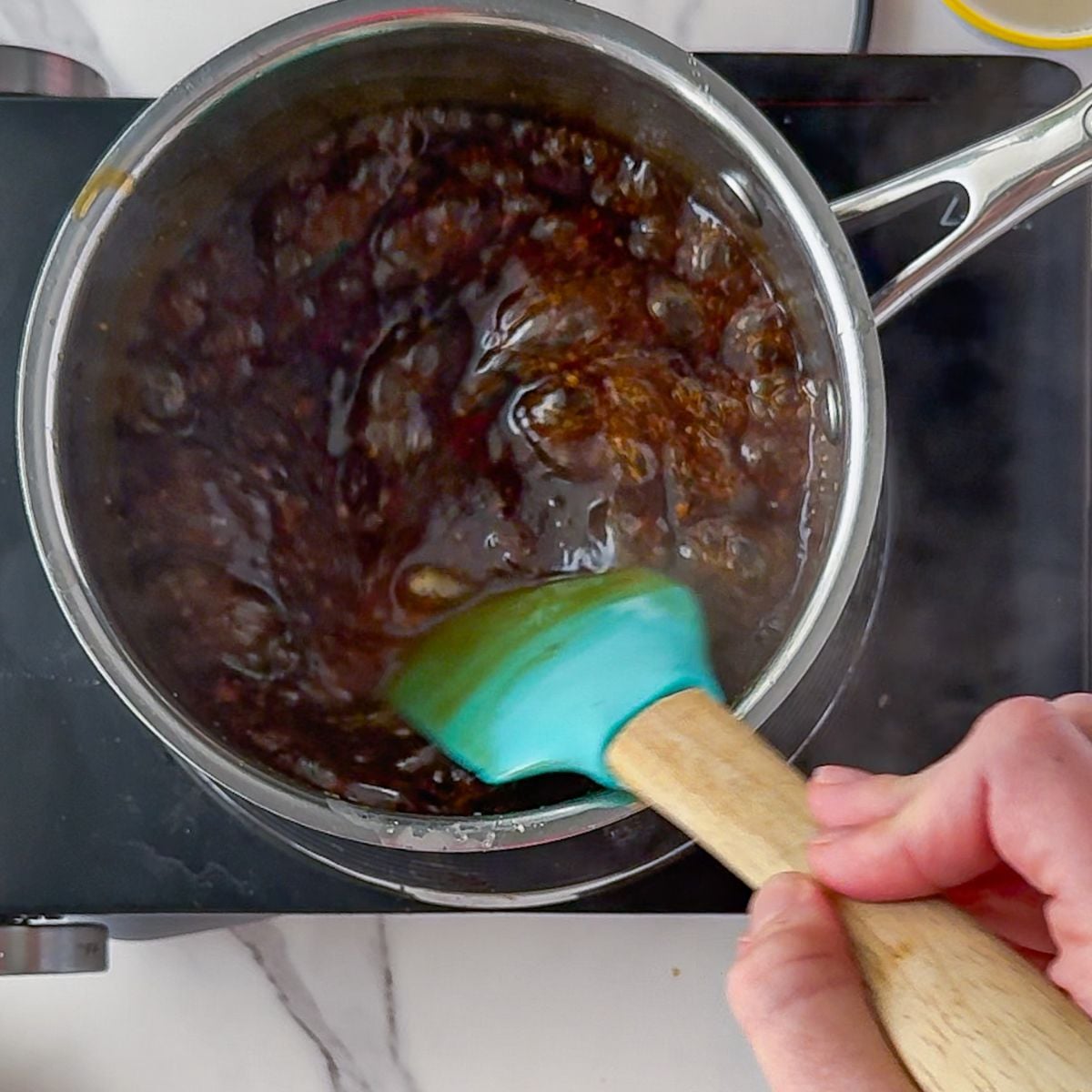 Thickening teriyaki sauce on the stovetop.