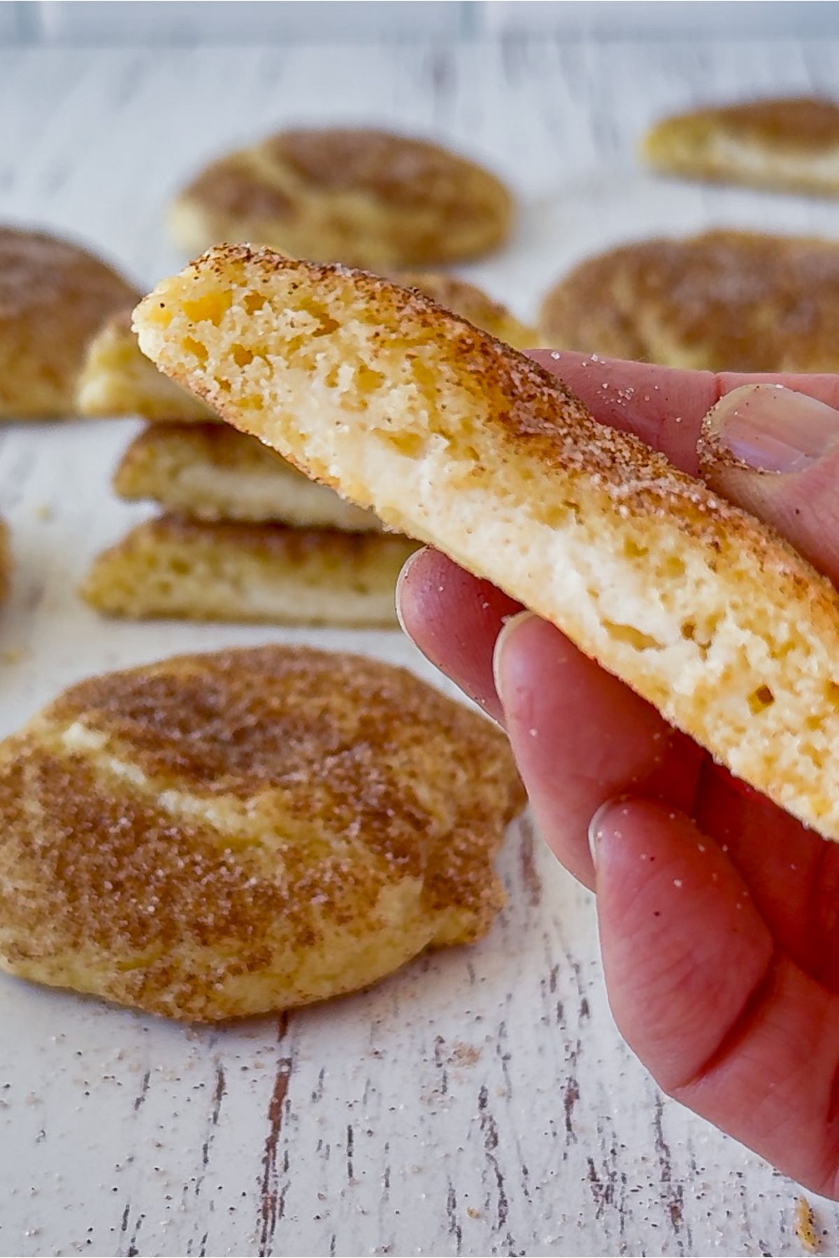 Churro cheesecake cookie in half.