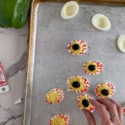 Adding the olives to look like pupils.