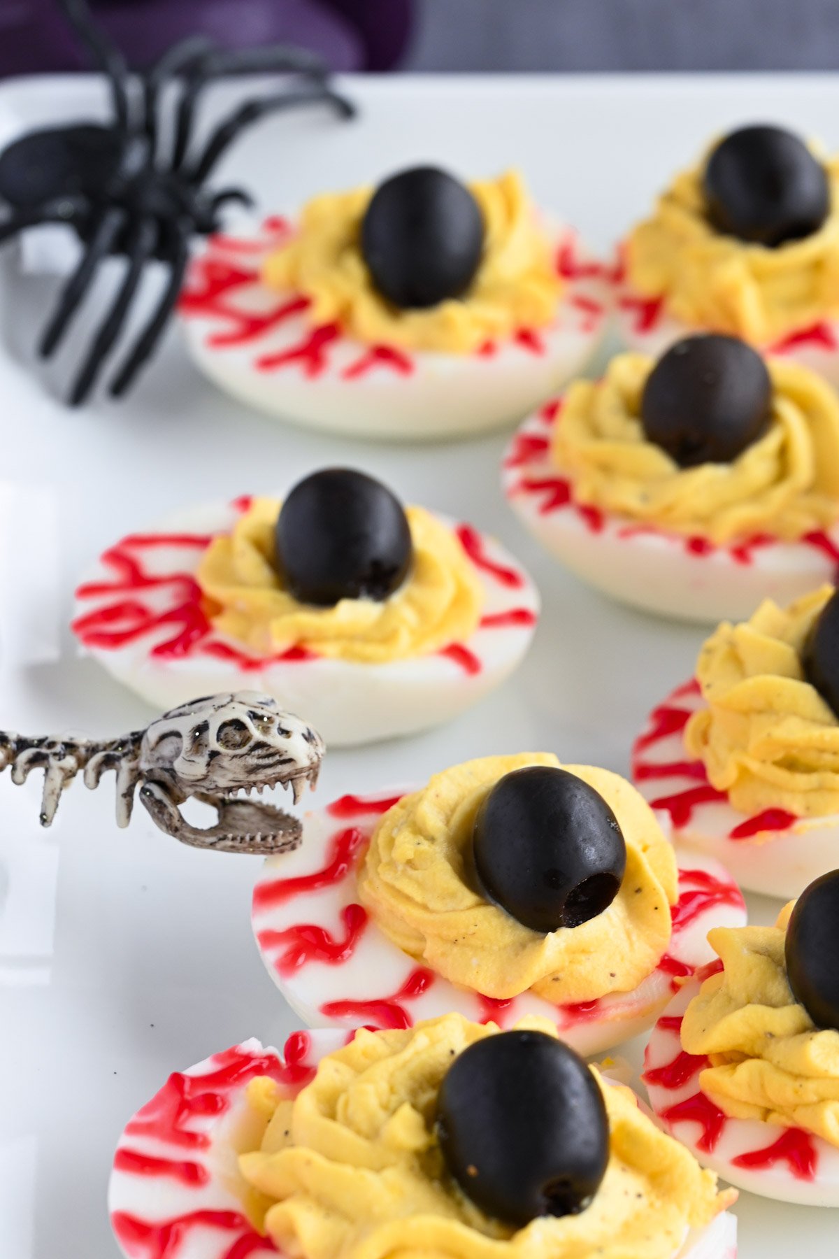 Halloween deviled eggs to look like eyes.