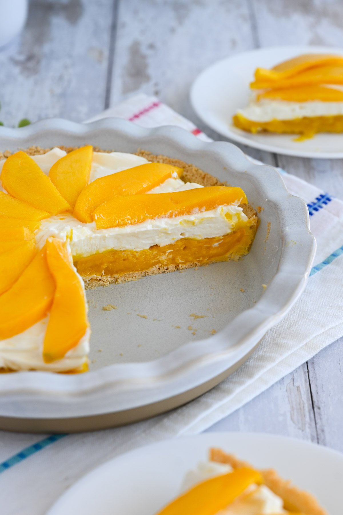 Mango pie with a slice out of it.