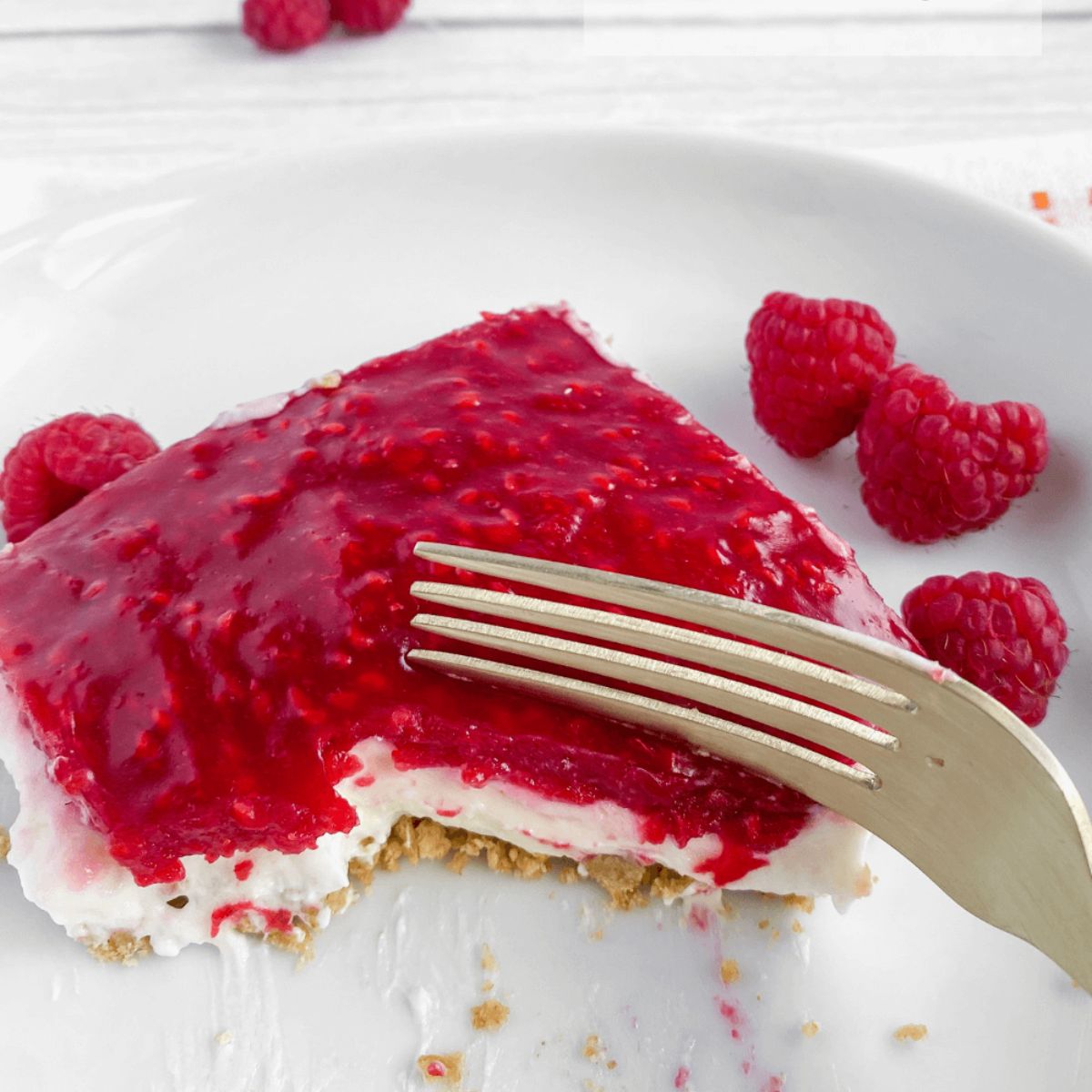 a piece of no bake dream whip cheesecake on a plate.