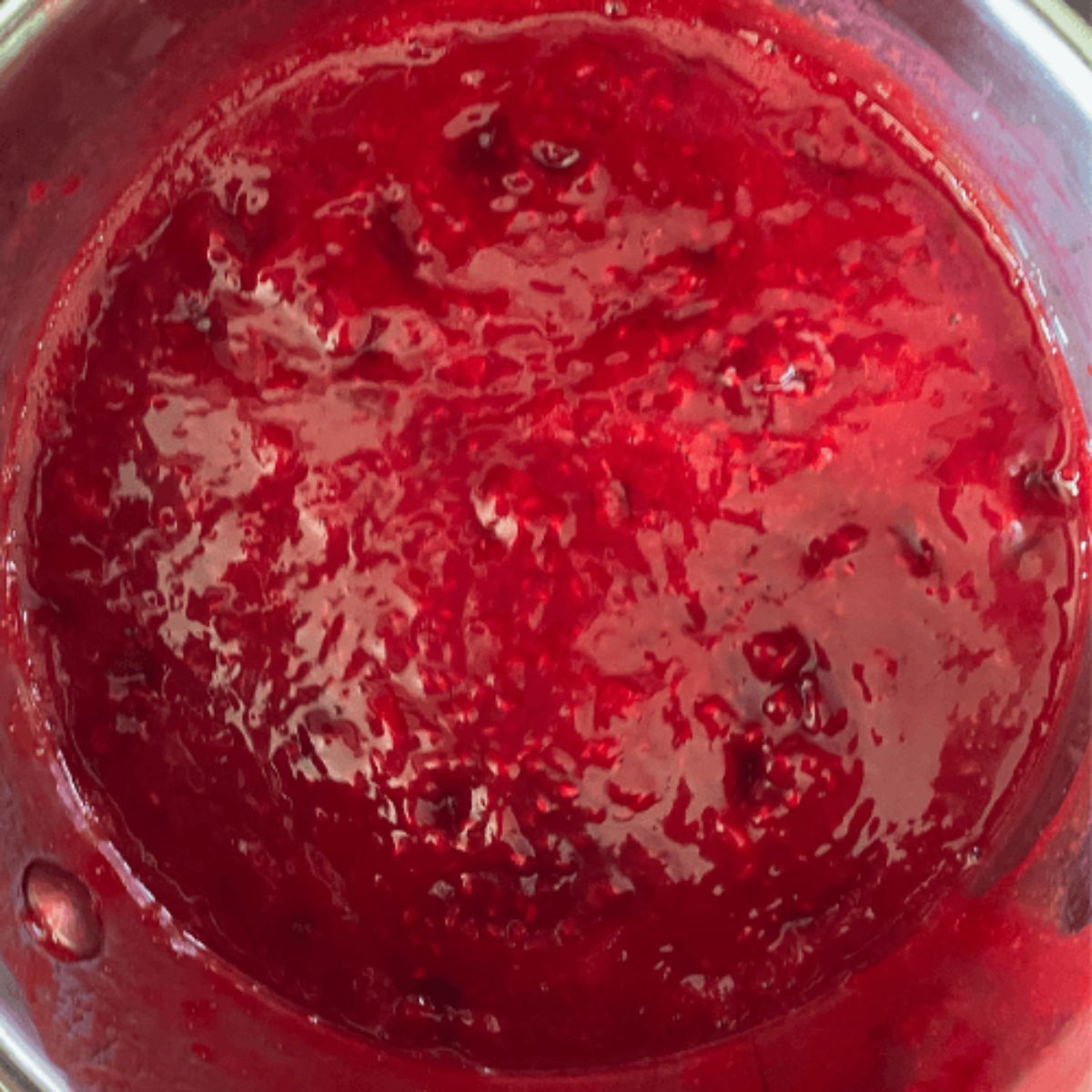 raspberry topping sauce in a saucepan.