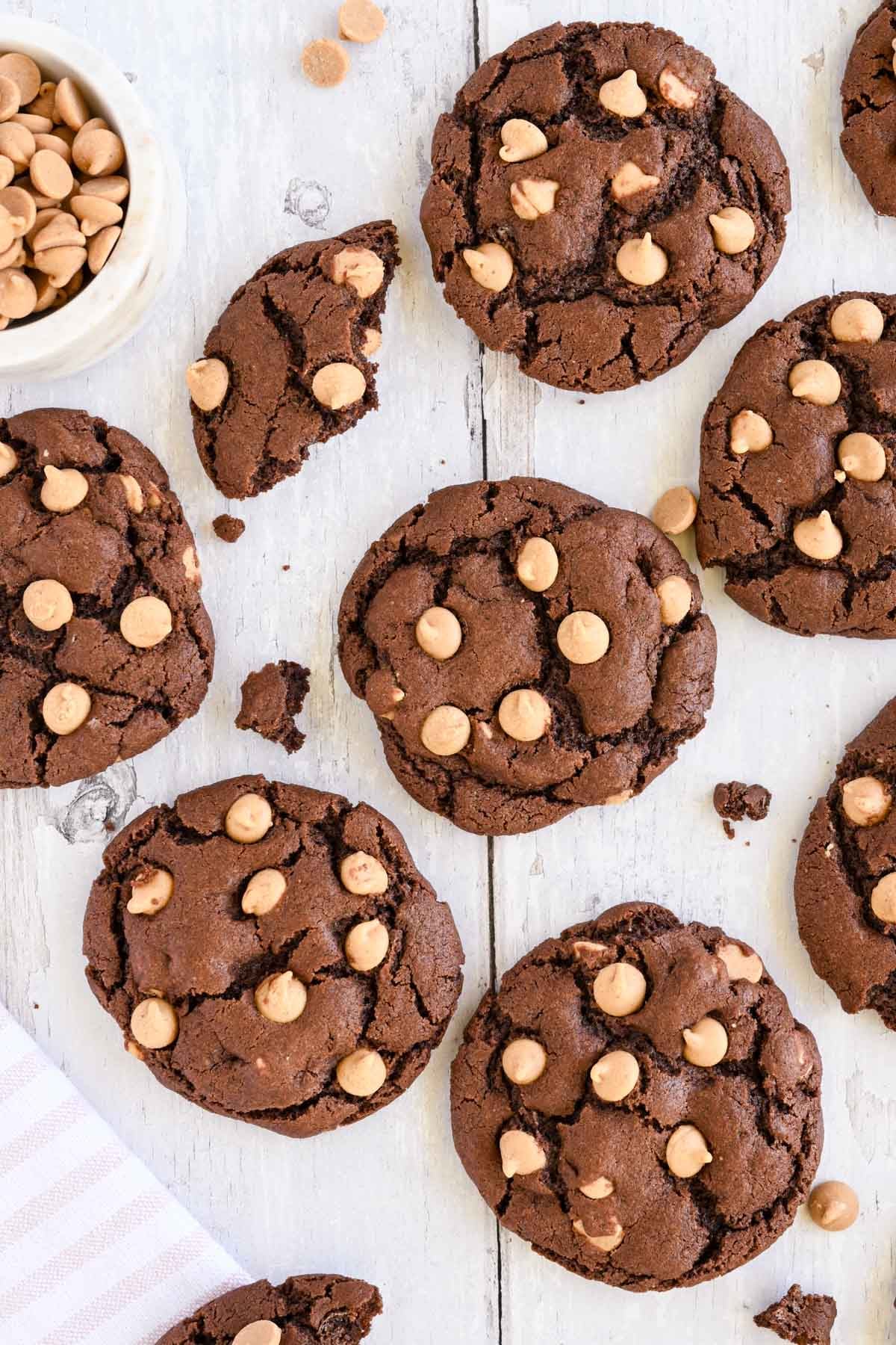 Chocolate peanut butter chip cookies on a sheet pan.
