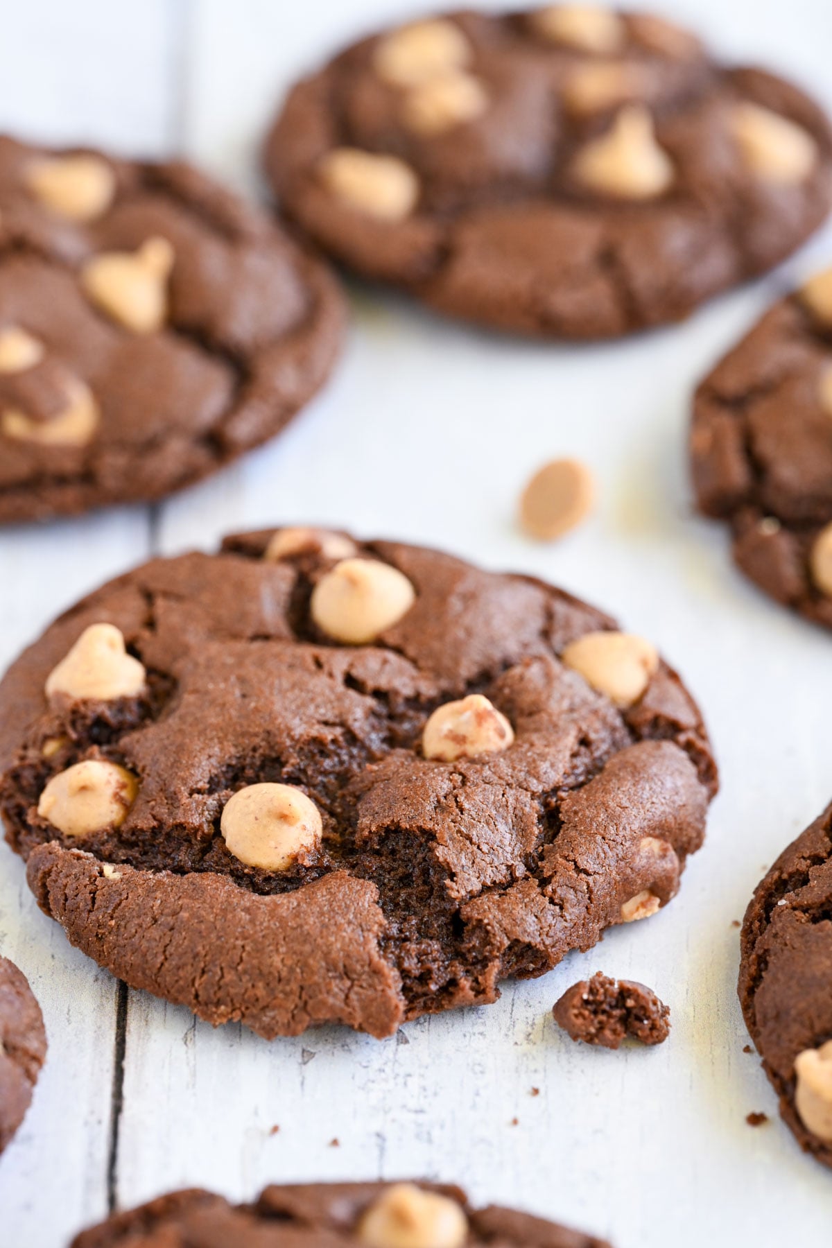 Chocolate peanut butter chip cookies on a sheet pan.