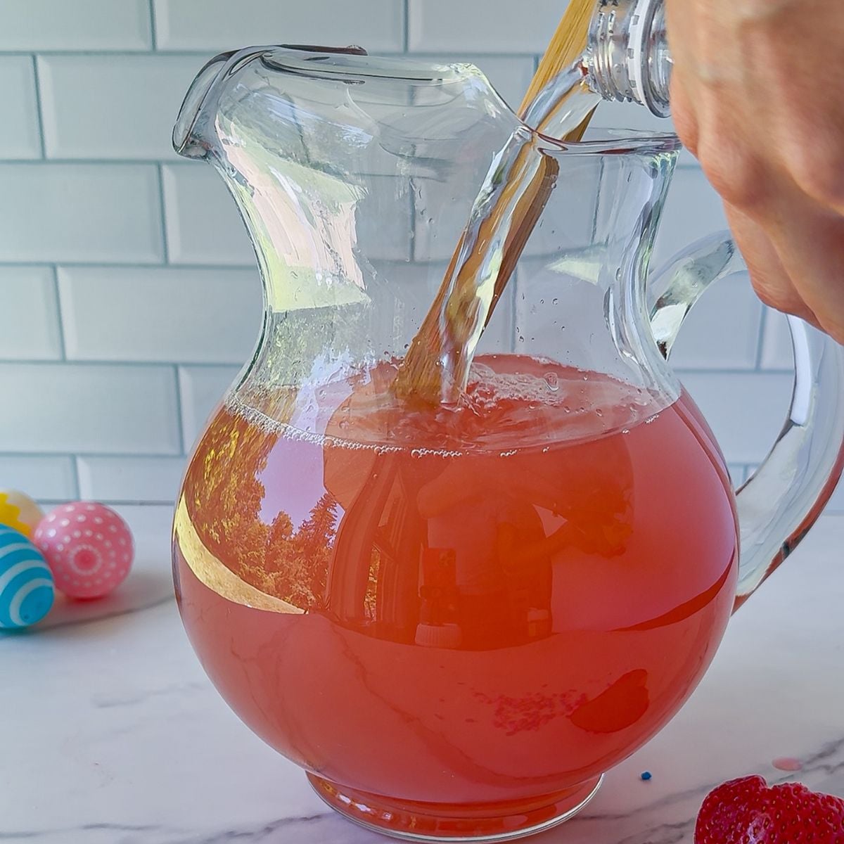 Pouring the ingredients into a pitcher.