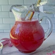 Add the remaining liquids into the pitchers.