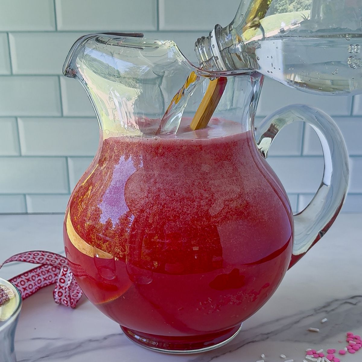 Add the remaining liquids into the pitchers.