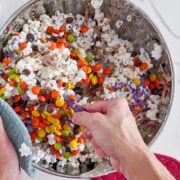 Mixing the popcorn and mix ins.