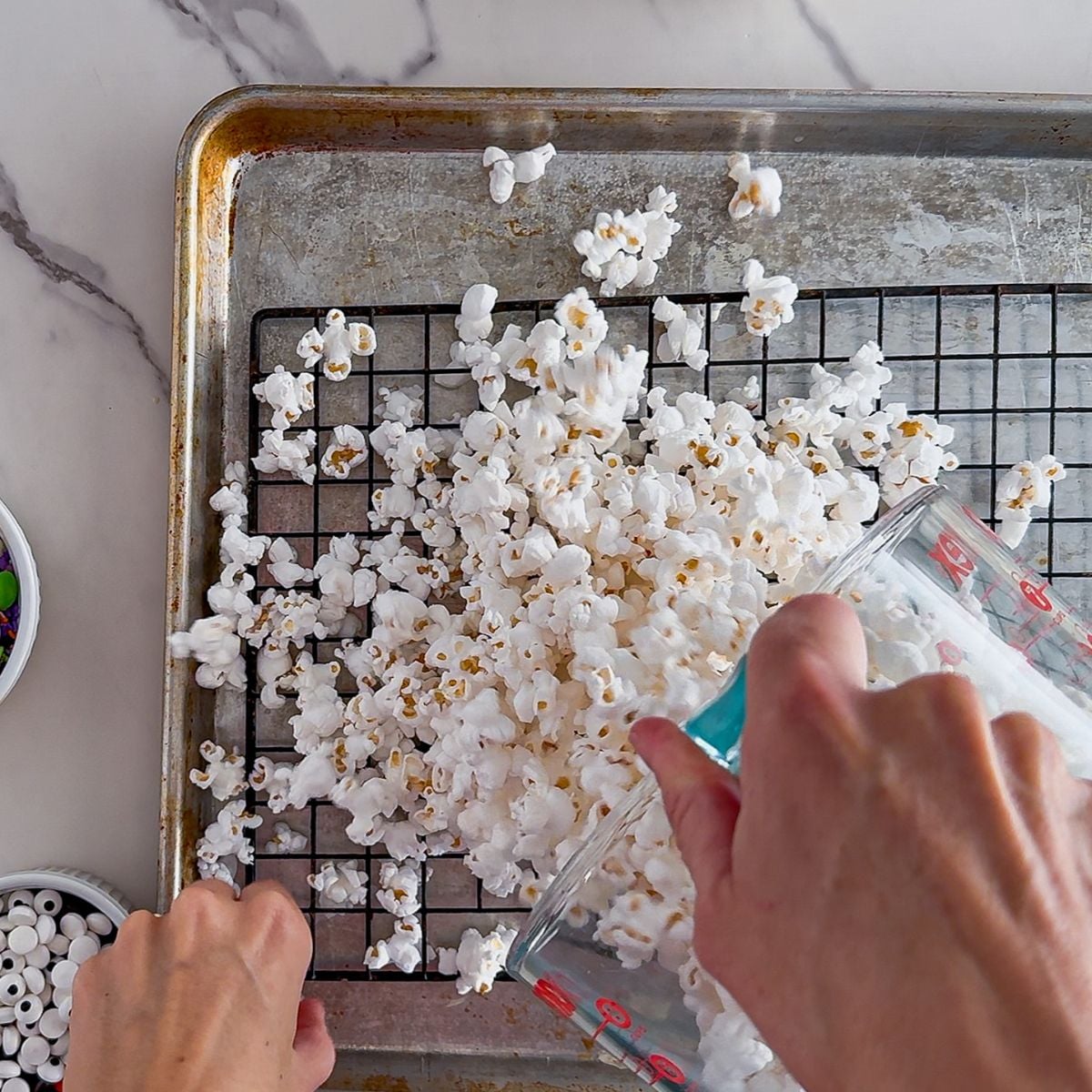 Sifting the popcorn.