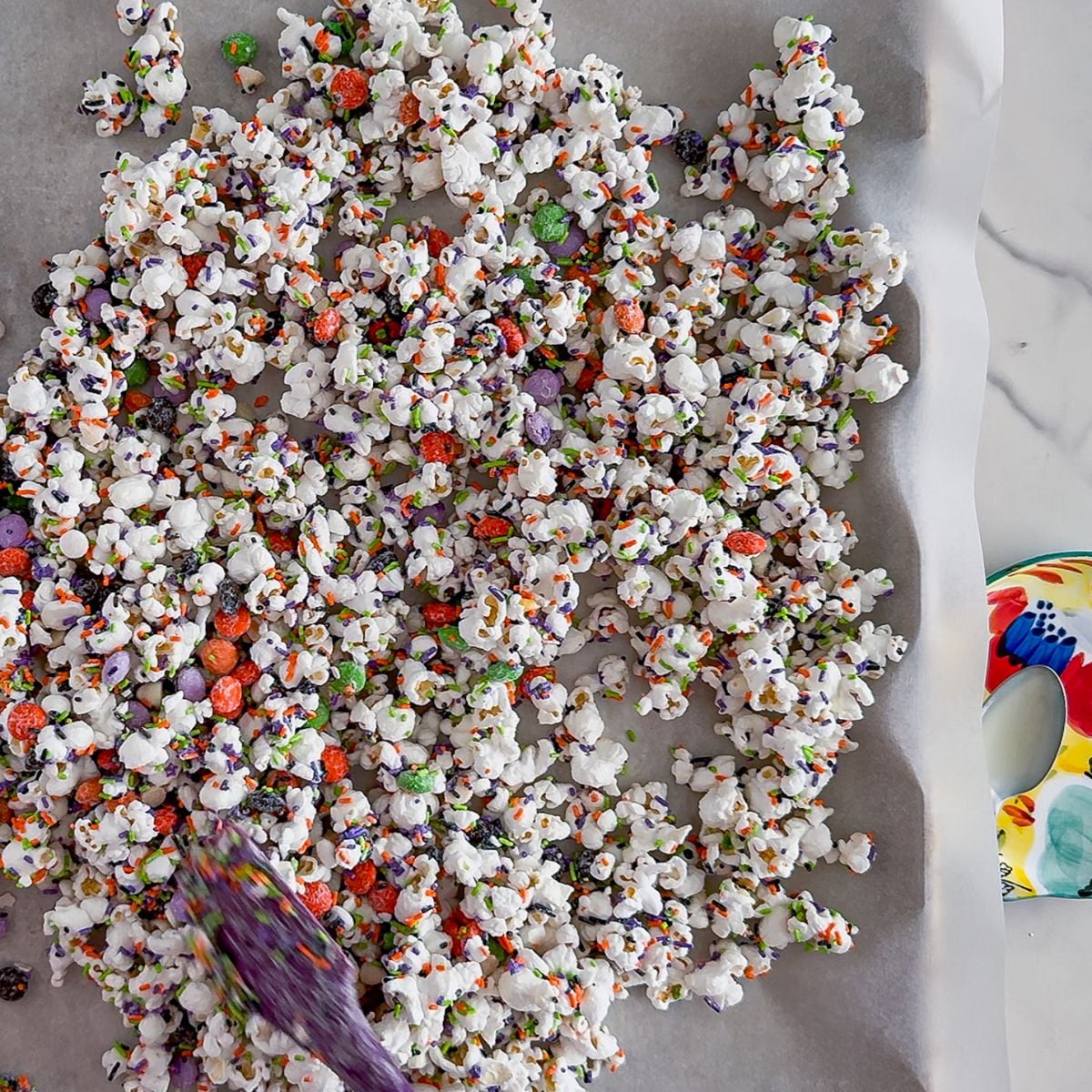 Mixing the halloween popcorn.
