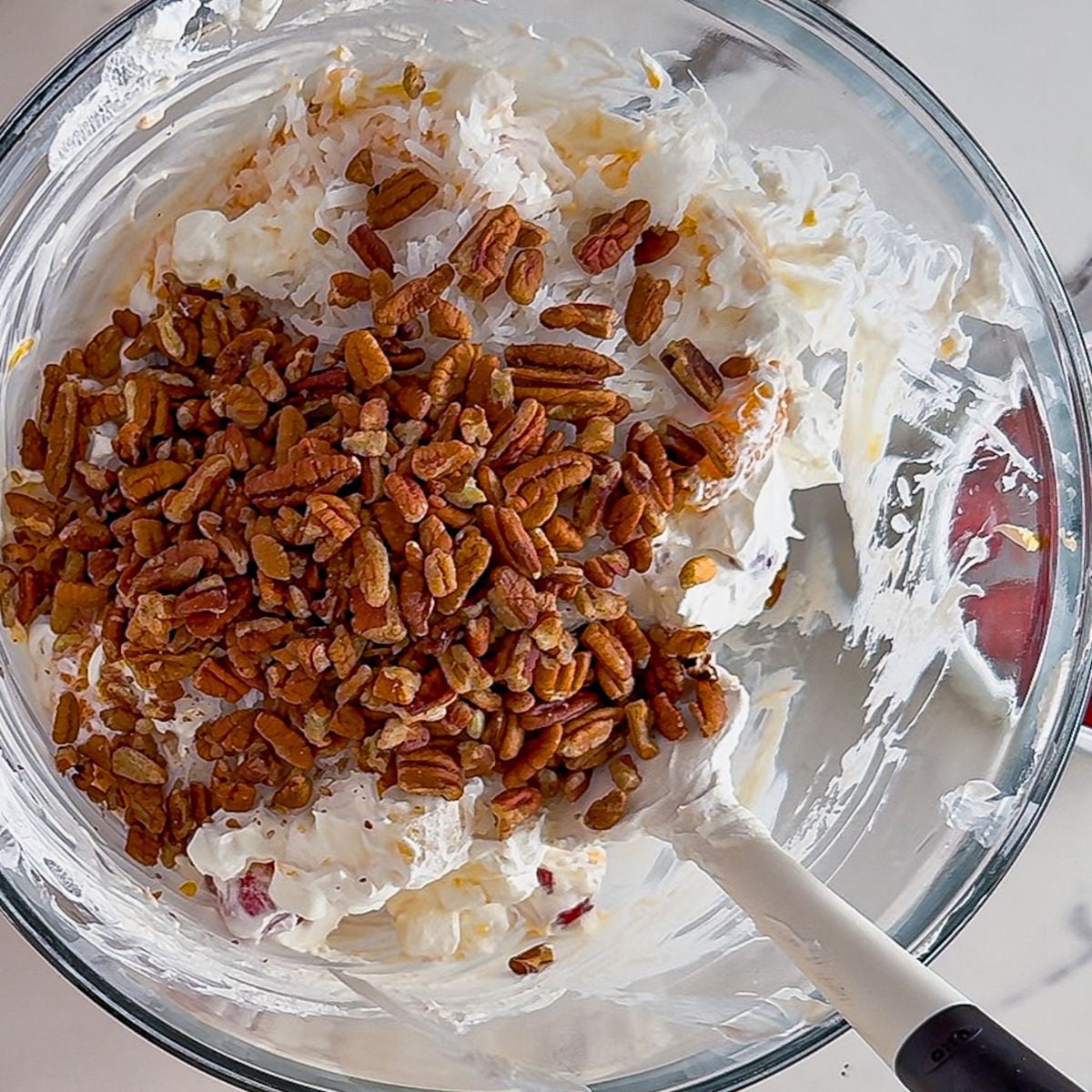 Mixing ambrosia salad.