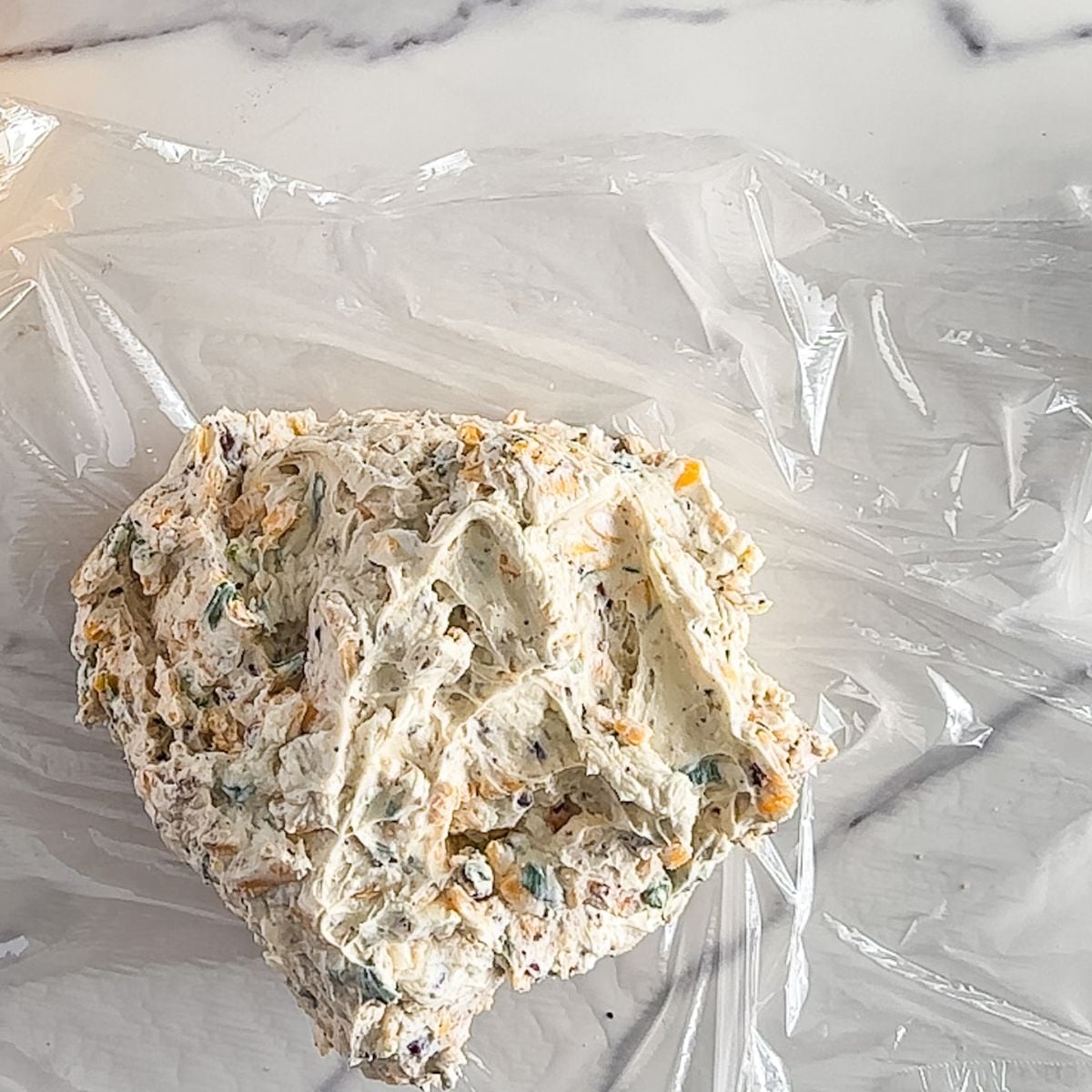 Mixing the ingredients for a cheese ball.