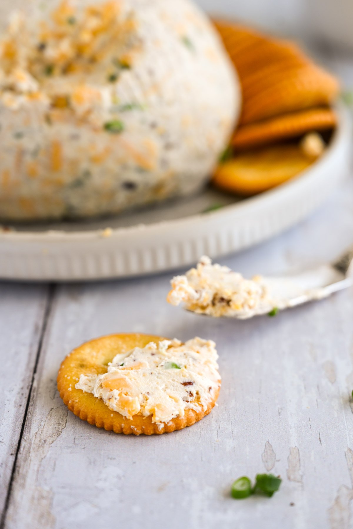 Cheese from a cheese ball on a cracker.