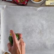 Spraying the parchment paper.