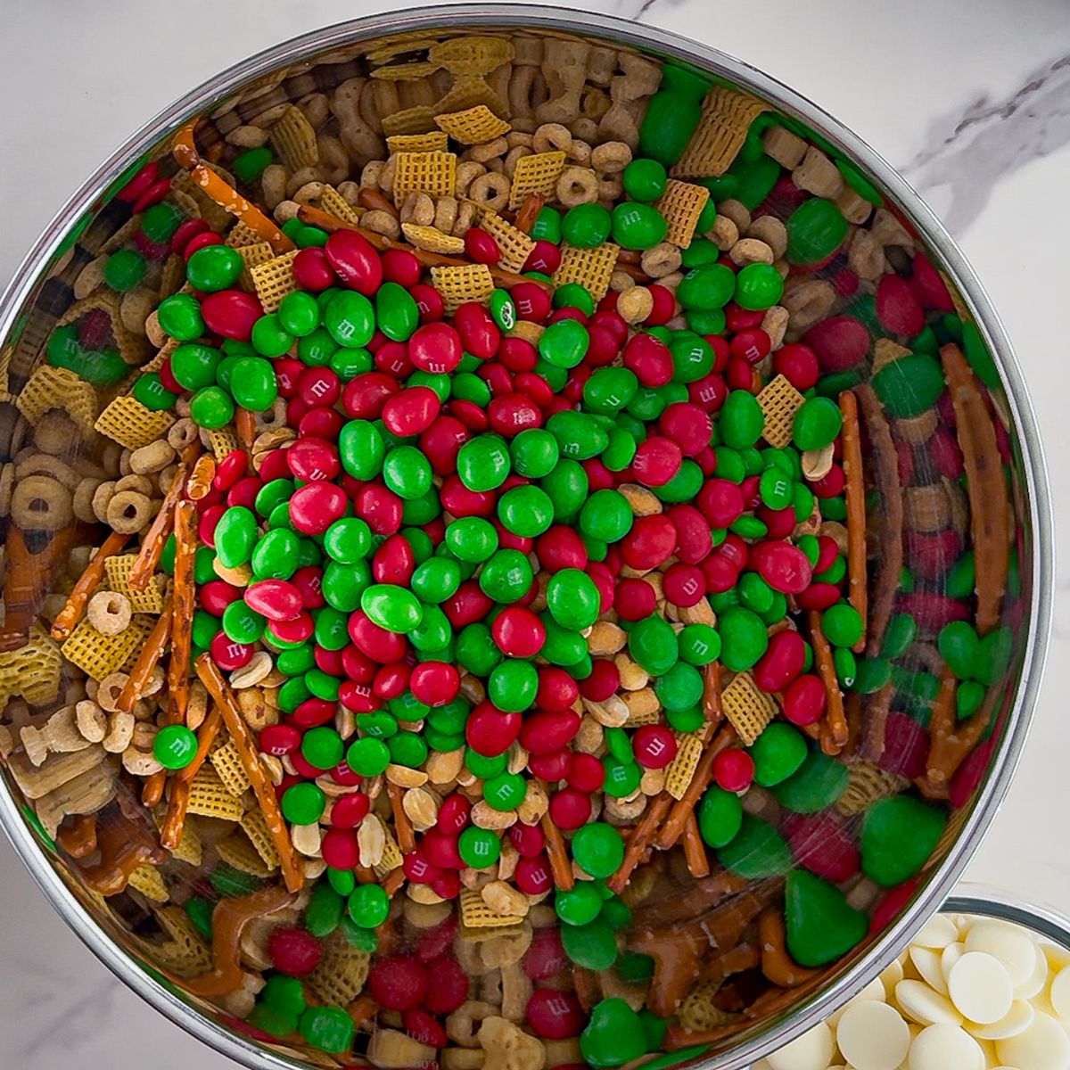 Bowl of ingredients for White trash Christmas mix.