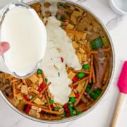 Pouring the white chocolate into the other ingredients.