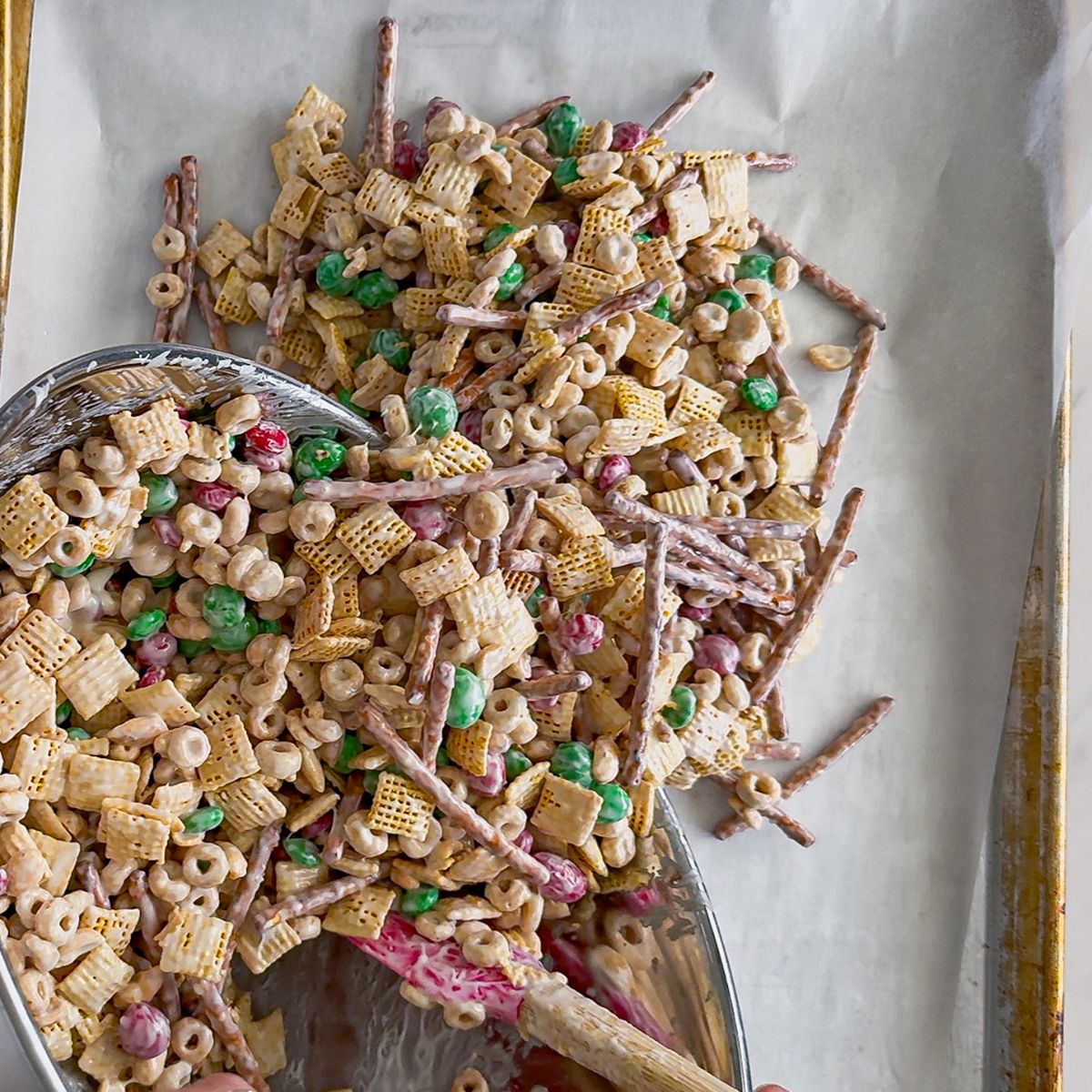 Mixing the white trash Christmas snack mix.