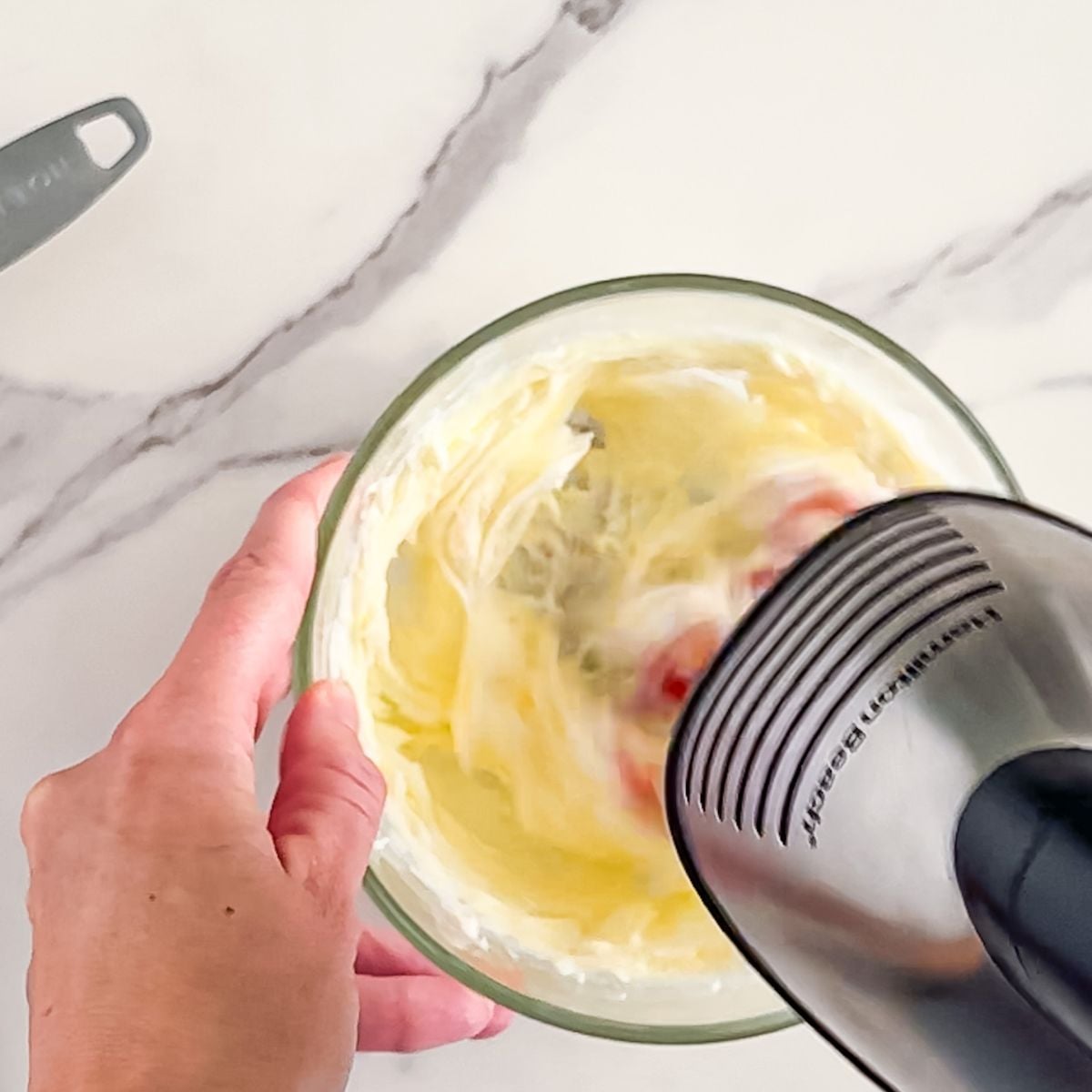 Whipping the butter.