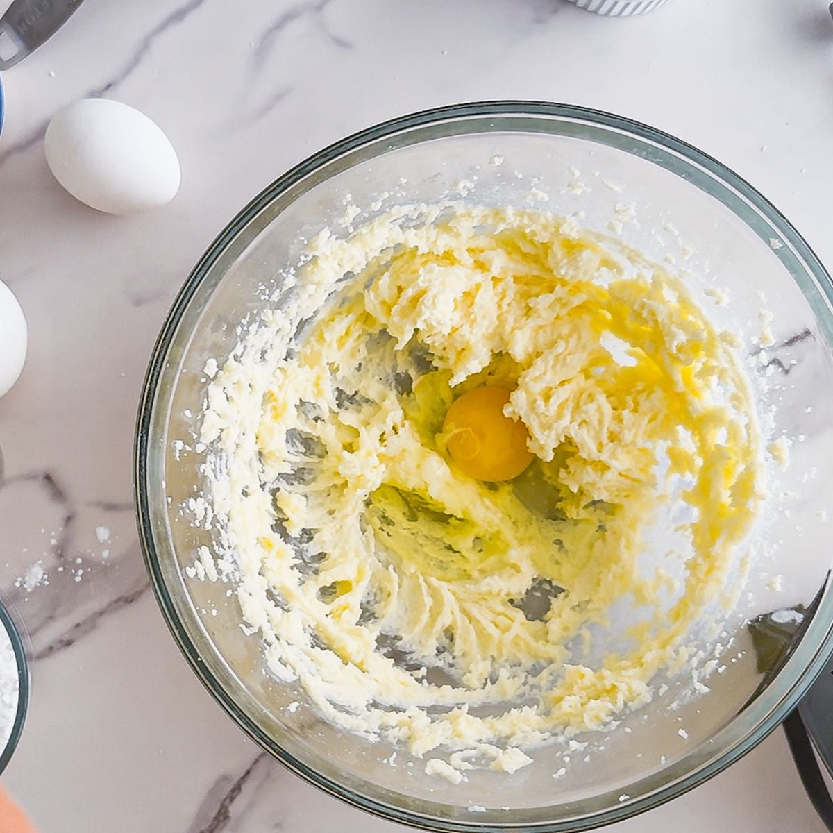 Creaming the sugar, butter, and egg.