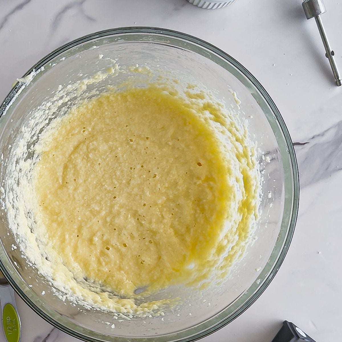 Combining the creamed butter and dry ingredients.