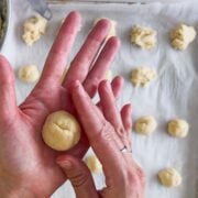 Rolling the dough for Italian wedding cookies.
