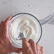 Whisking the frosting for Italian wedding cookies.