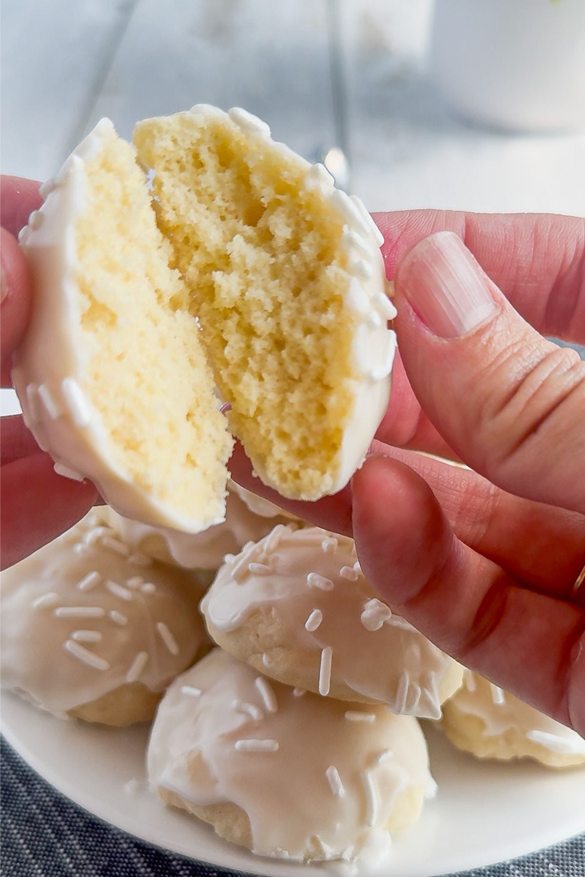 Italian wedding cookie broken in half.