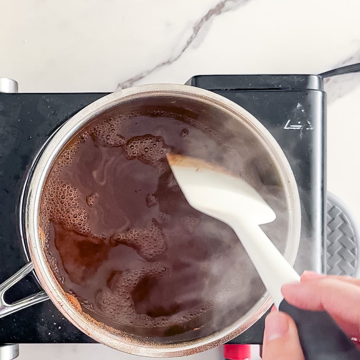Melting chocolate on the stove top.