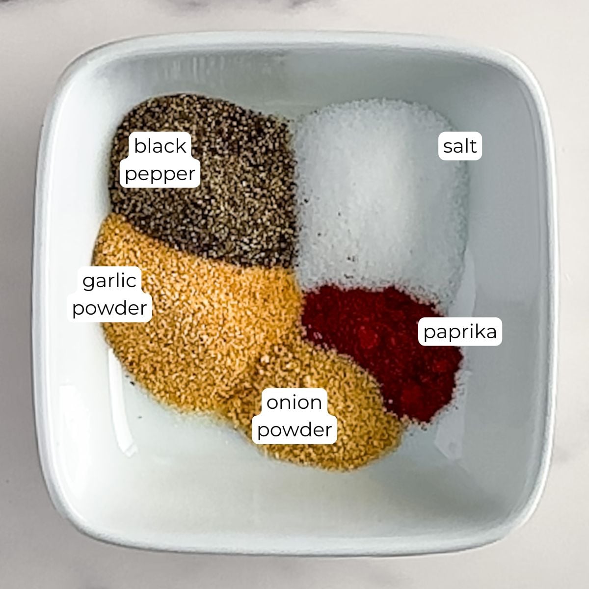 Bowl of ingredients for Philly cheesesteak seasoning.