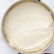 Adding the batter to a springform pan.