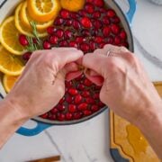 Adding all the ingredients to a pot to boil.