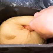 Poking the rising dough.