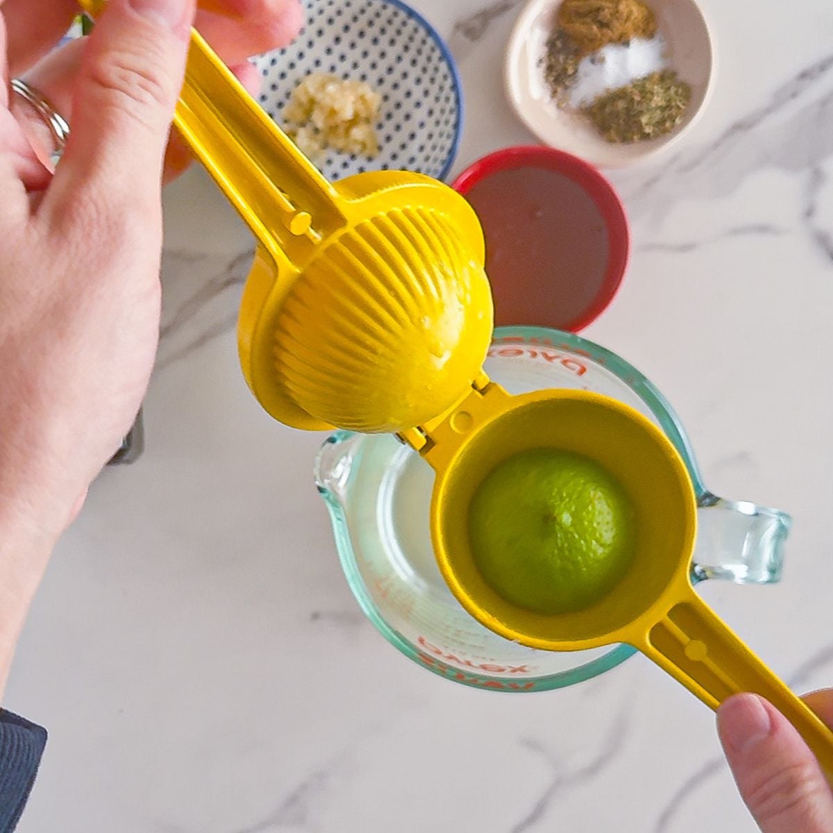 Juicing the lime for the chipotle honey vinaigrette.