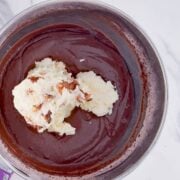 Adding the cream cheese to the pudding.