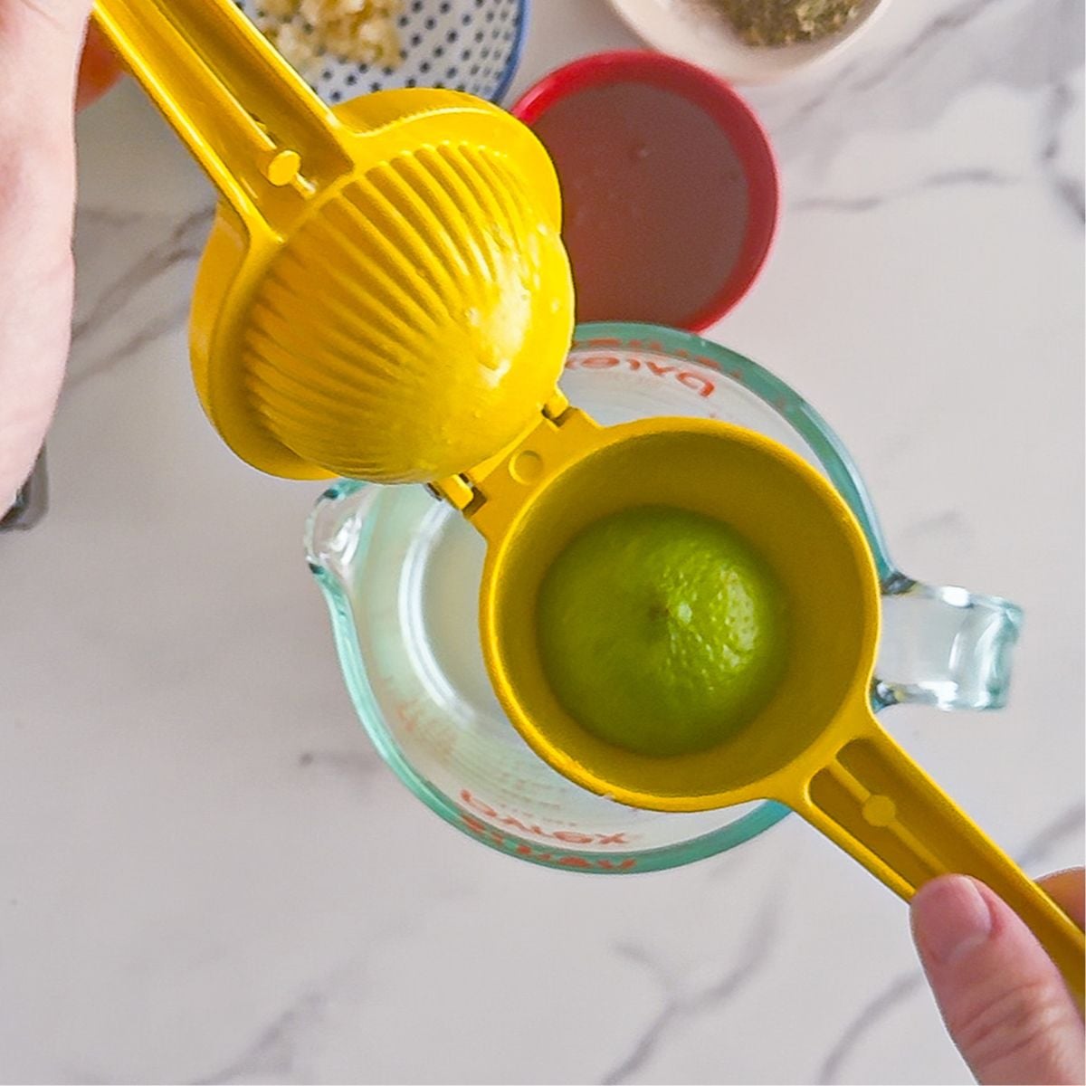 Squeezing the fresh lemon.