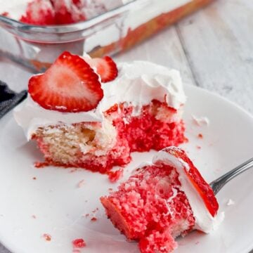 Slice of strawberry poke cake.