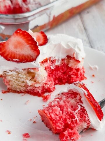 Slice of strawberry poke cake.