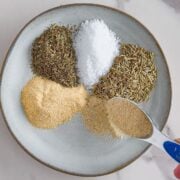 Adding turkey seasoning to a bowl.